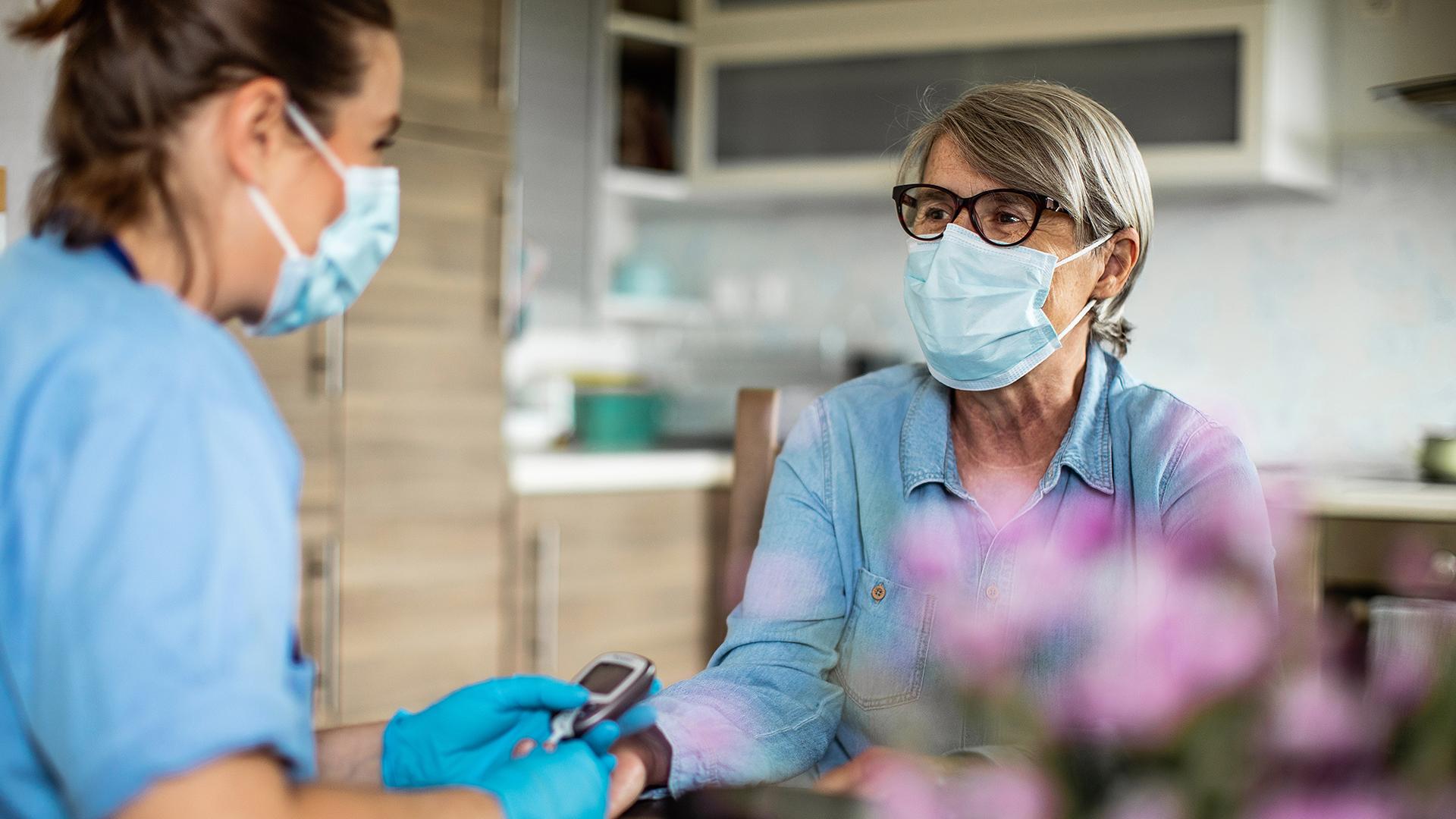 Healthcare professional helping a patient