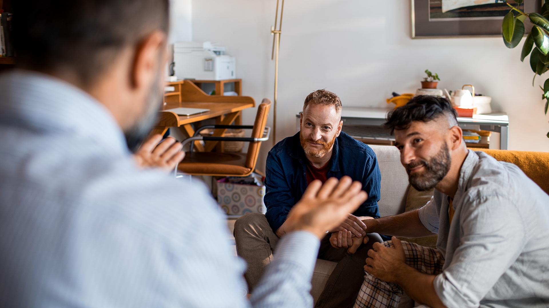 LGBTQ couple speaking with advisor