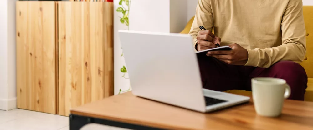 Close up of man sitting at laptop