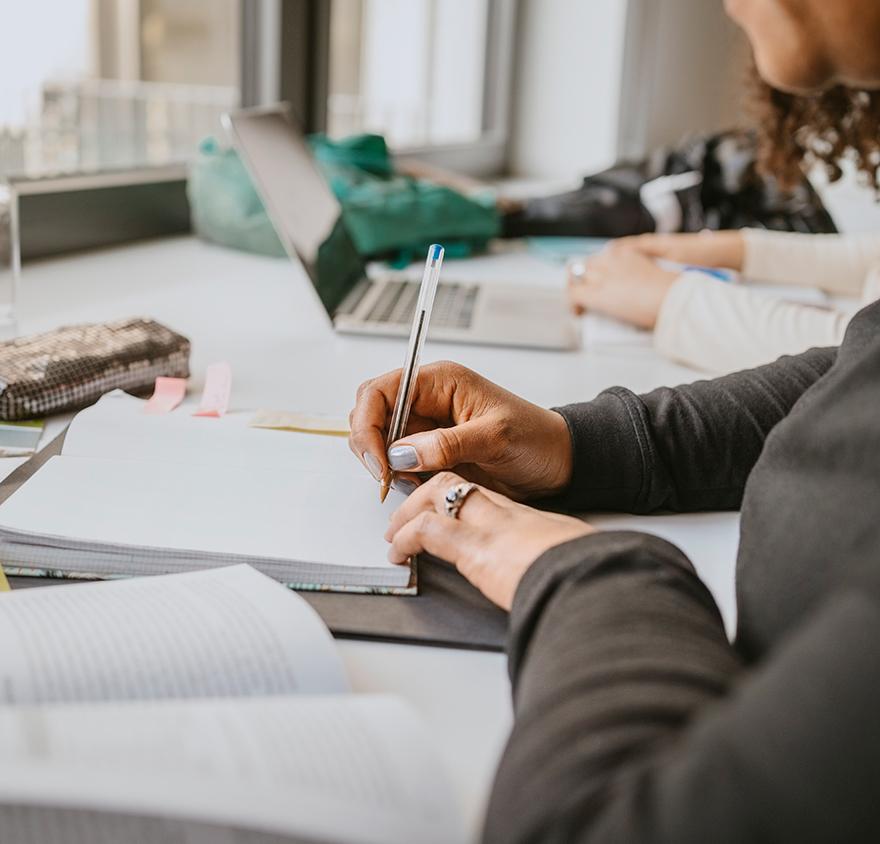 Women writing on a notepad