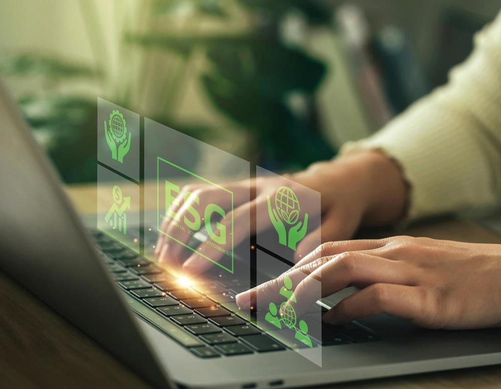 Financial professional typing on computer keyboard