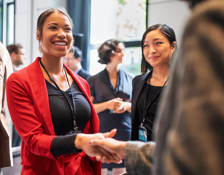 Two women shaking hands