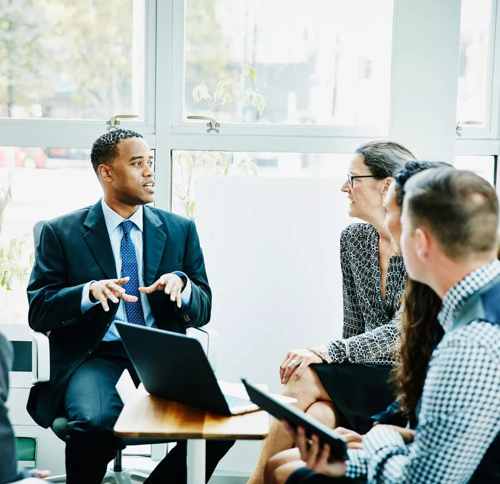 Financial business professionals talking around the table