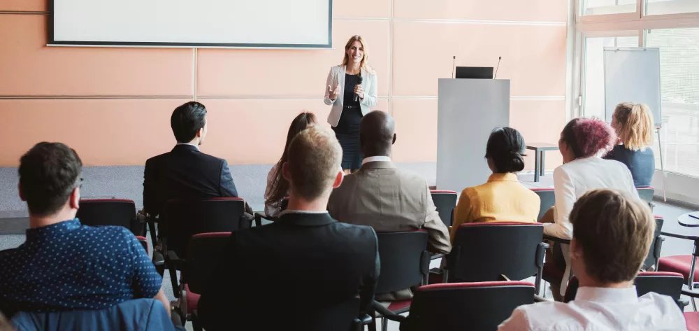 A woman speaking to a group of people