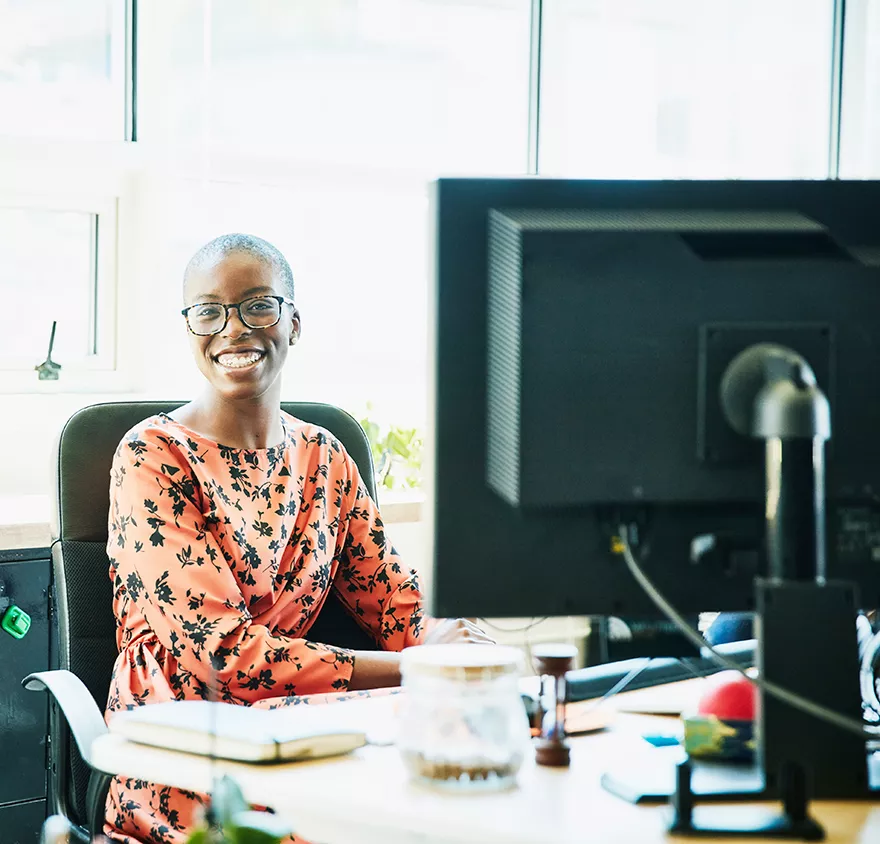 A woman sitting at a desktop