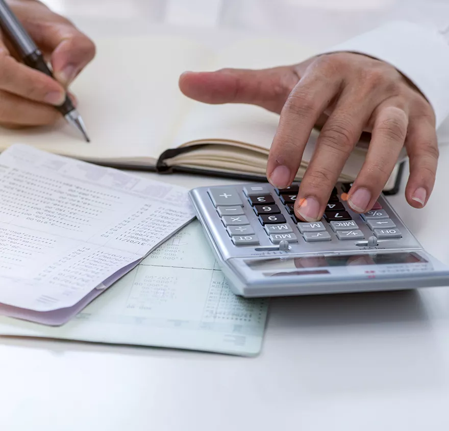 Close up of someone using a calculator