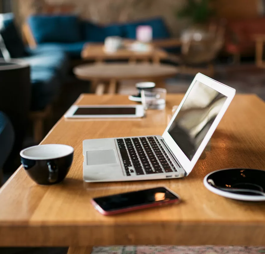 Laptop and phone sitting on a table