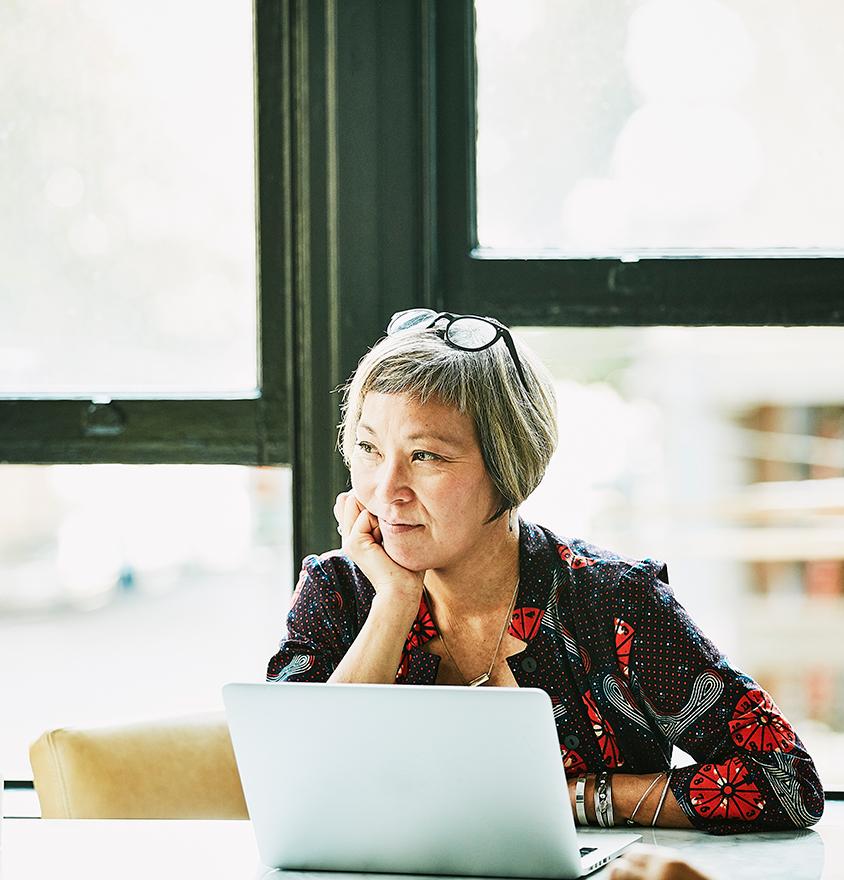 Woman sitting at a laptop