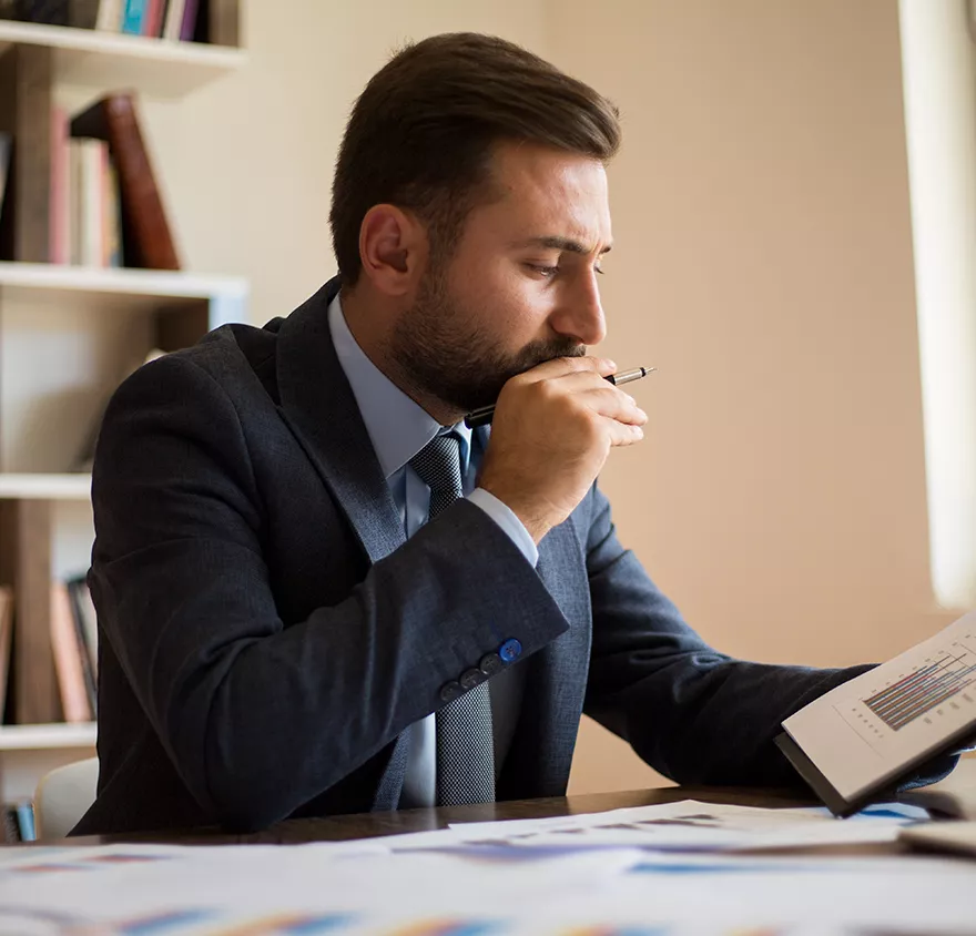 Man looking at a graph report