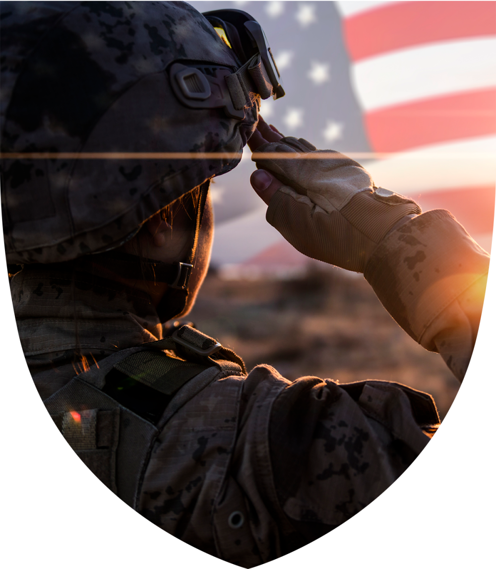 Soldier saluting with American flag in background