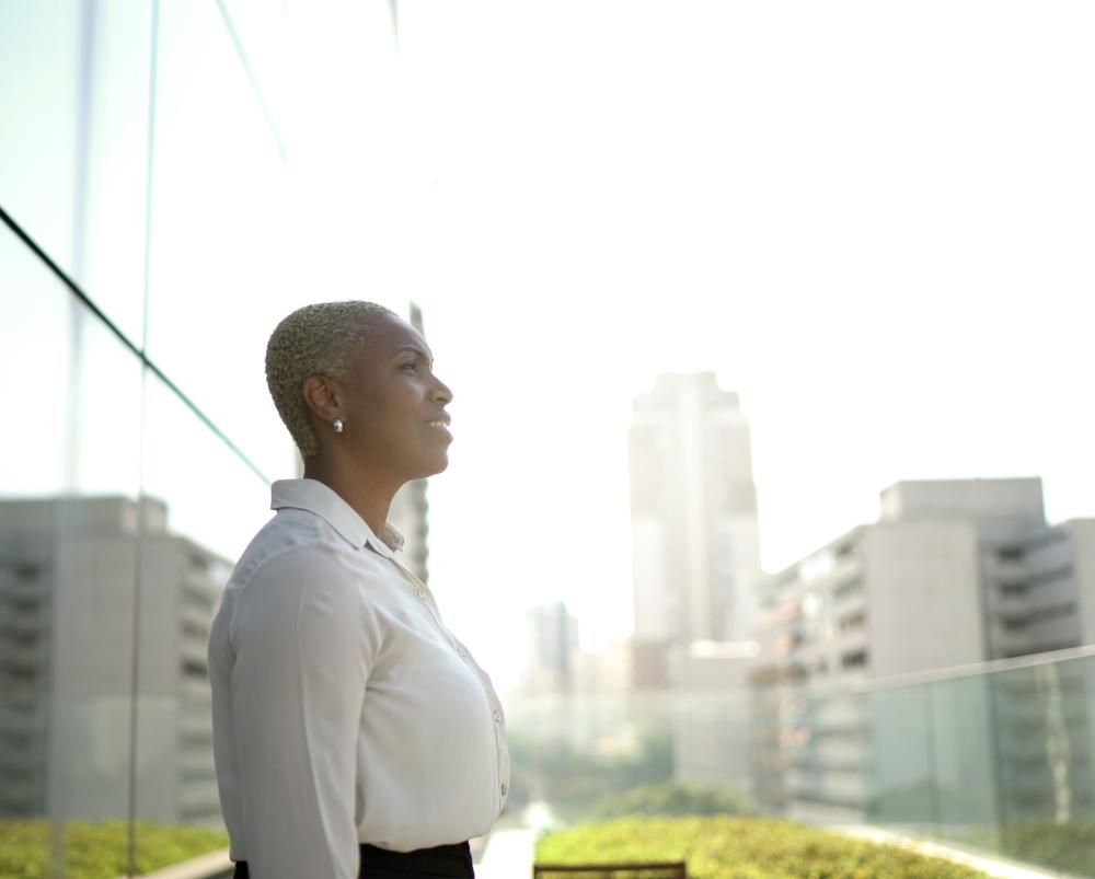 Woman standing outside of an office building