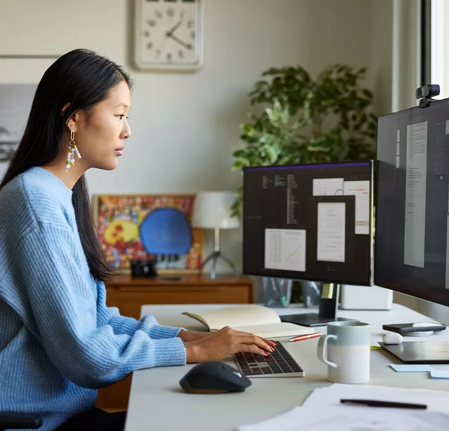 Woman working at a desktop computer