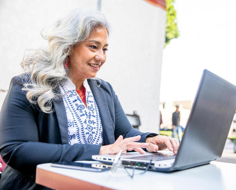 Woman sitting at a laptop