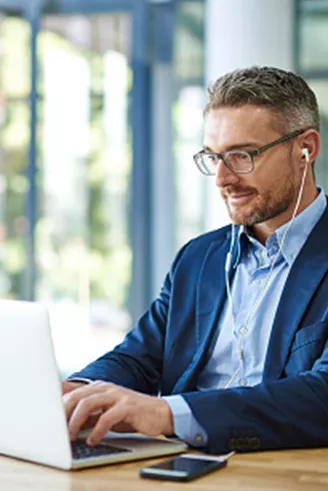 Man sitting at a laptop