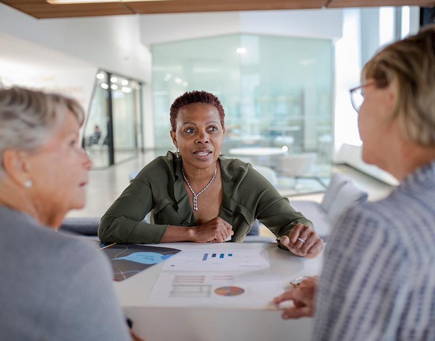 Estate planning professional meeting with an elderly family