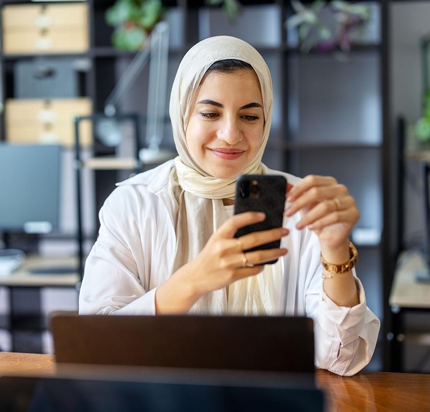 Women looking at phone and researching estate planning courses