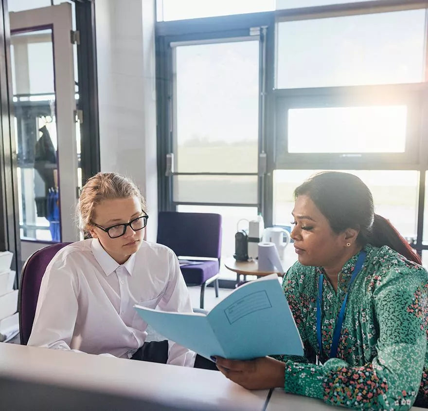 Professor working with student to study for certificate
