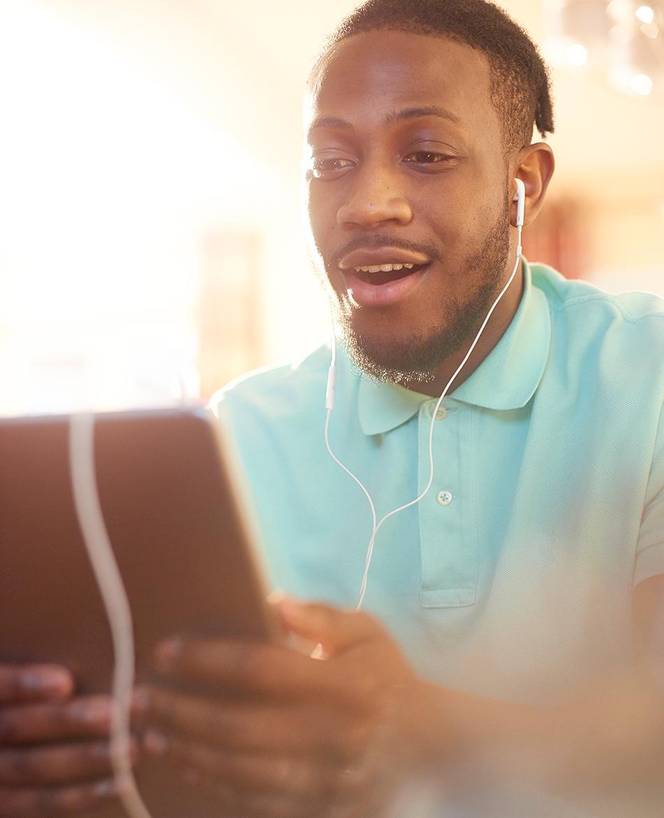 A man looking at a tablet