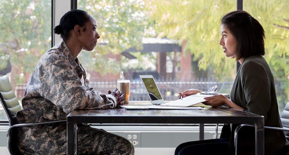 Service woman consulting with an advisor