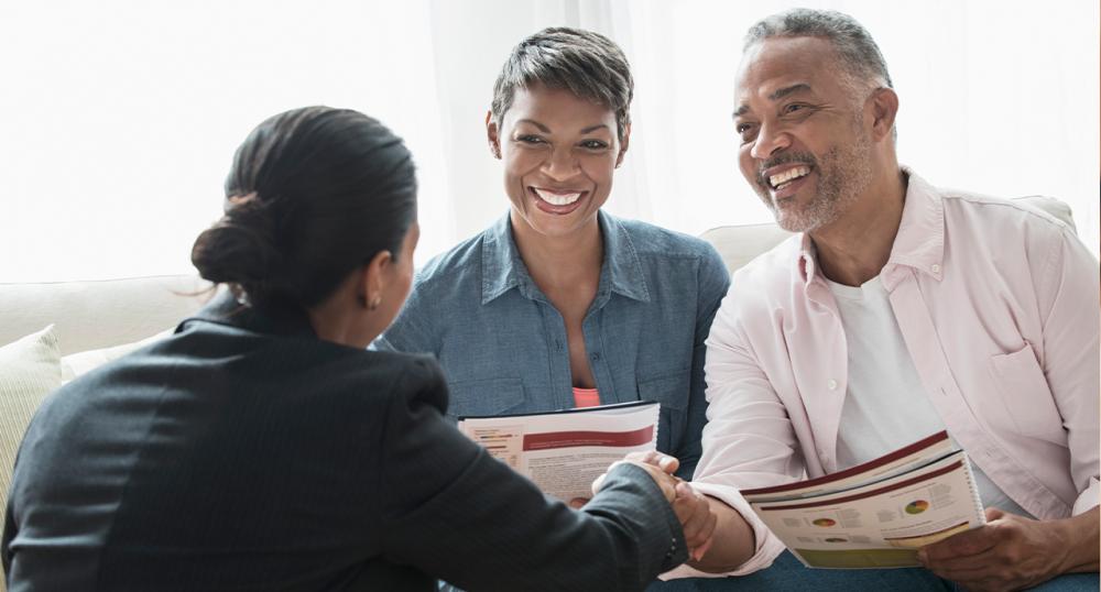 Black couple talking with ethical advisor on their financial options