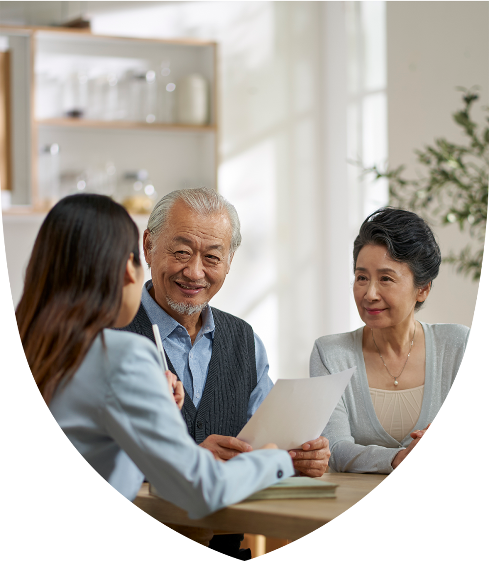 Elderly couple speaking with retirement professional