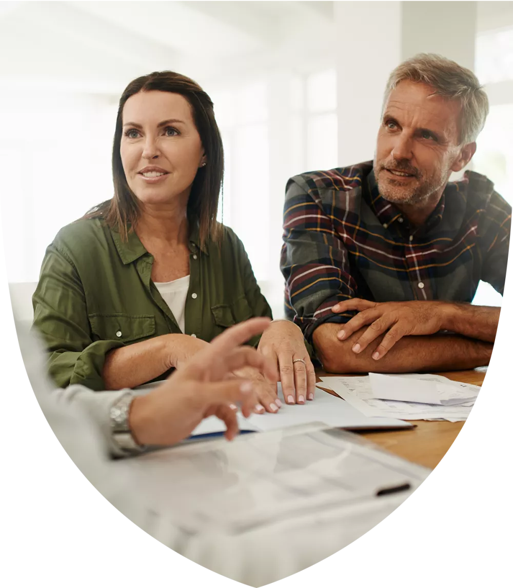 Young married couple speaking to a retirement professional