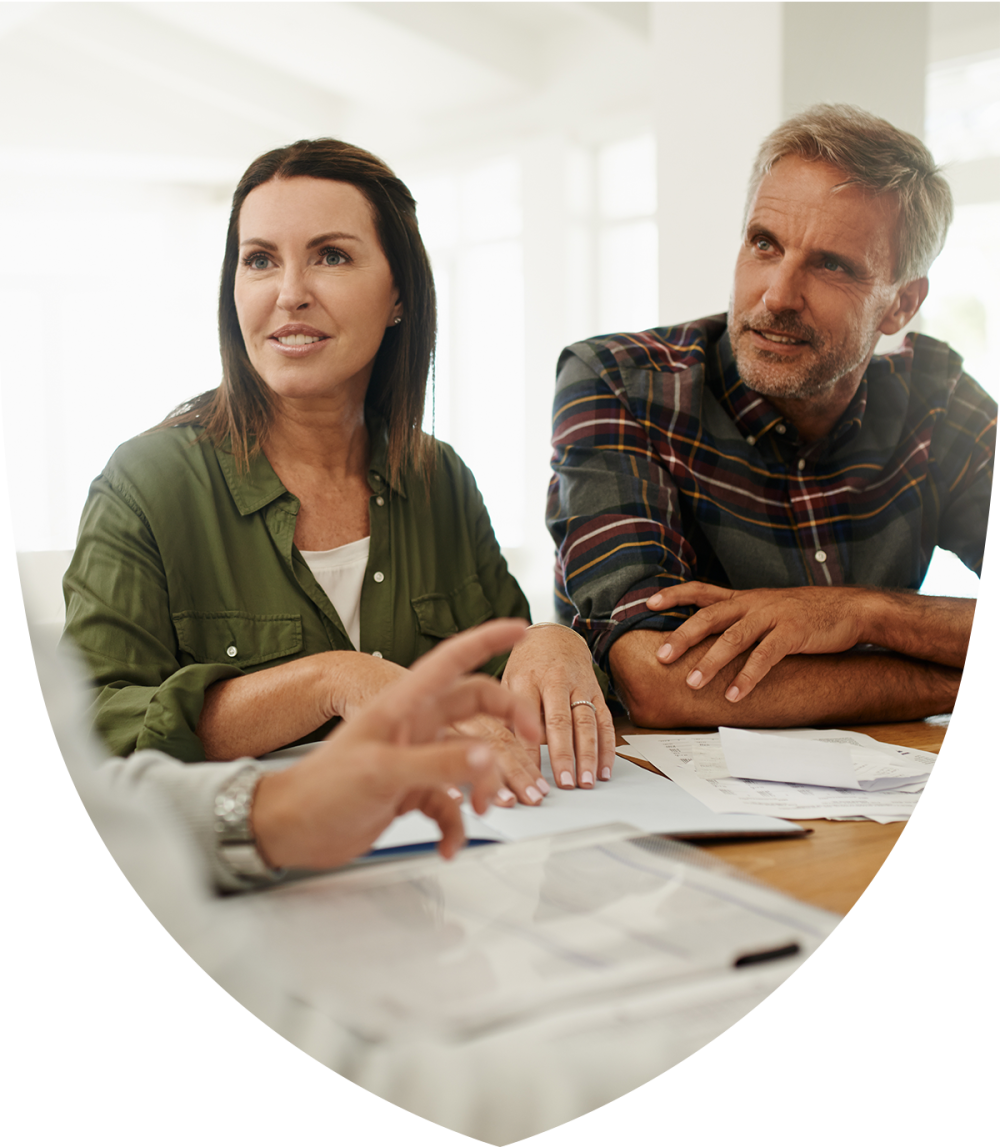 Young married couple speaking to a retirement professional