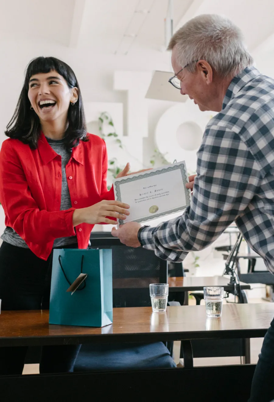 Woman being presented with a certificate