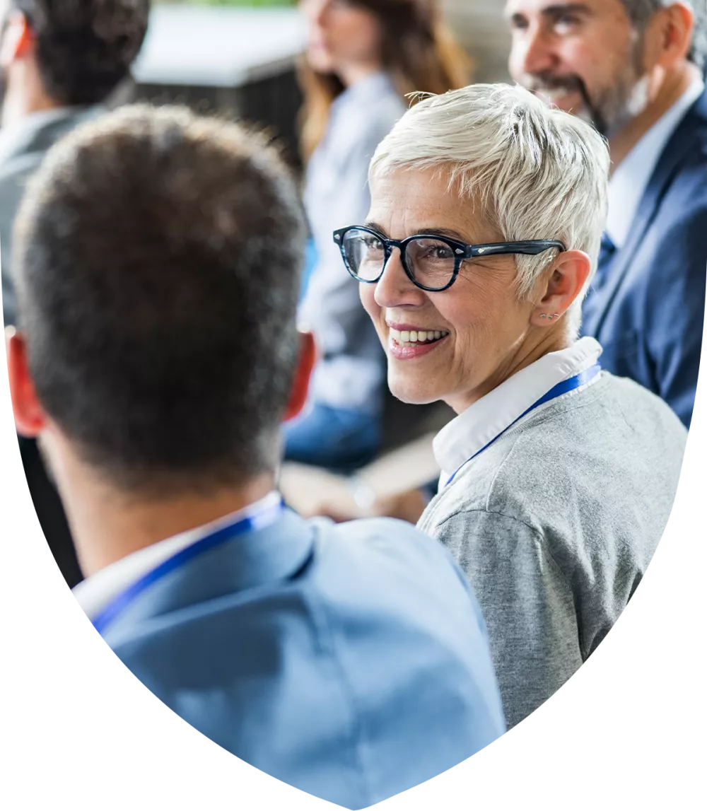 Older female advisor collaborating with a colleague 