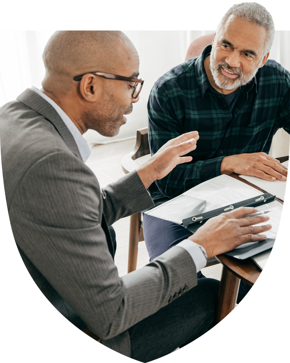 Elderly man working with his financial advisor\