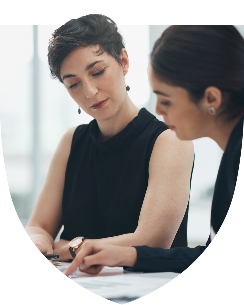 Two women studying for the tax planning certificate