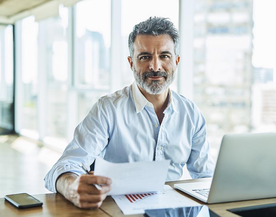 Male tax professional working at his desk