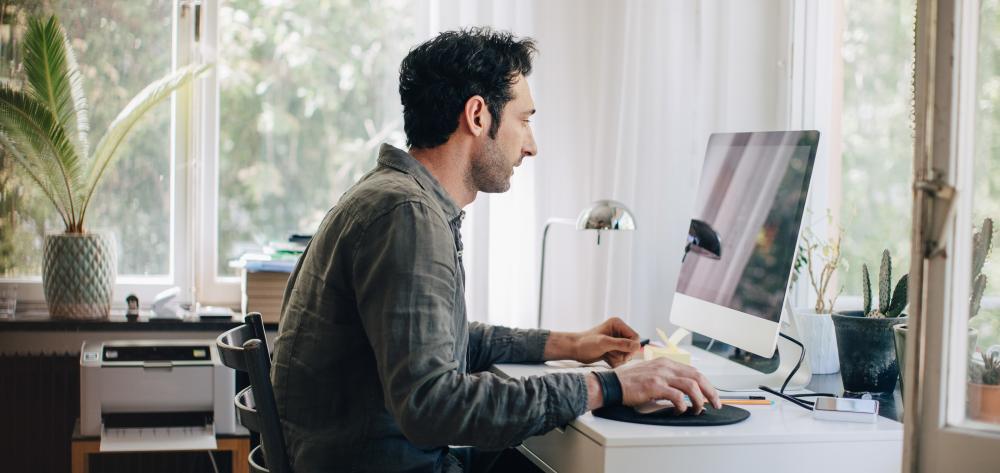 Financial advisor browsing Knowledge Hub plus on his computer