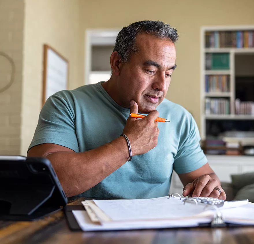 Middle aged man considering tax planning certification