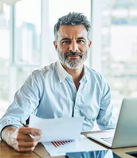 Middle aged man working at his desk