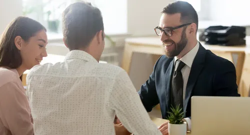 Male advisor meeting with his married couple clients