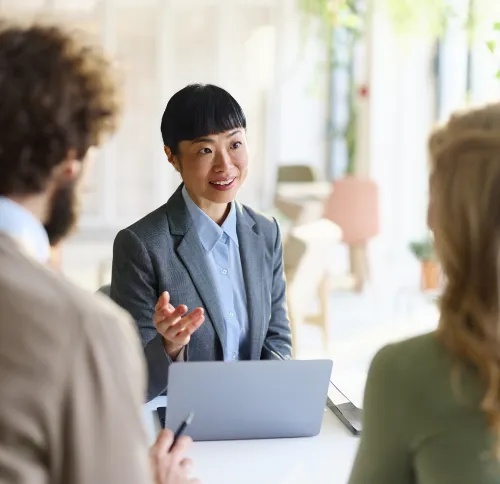 Confident professional woman leading a meeting at work