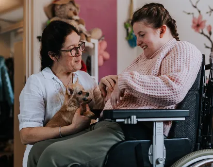 Woman caring for woman with special needs
