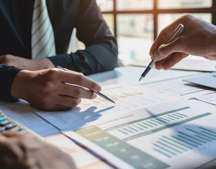 Group of financial advisors working on a spreadsheet together